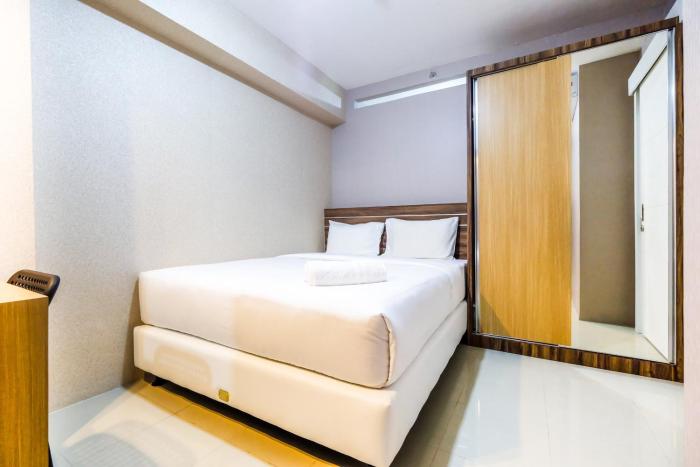 Classic 2BR Bassura City Apartment By Travelio