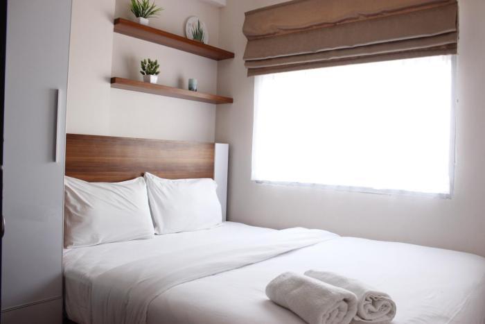 Comfy 2BR Apartment at Grand Asia Afrika By Travelio