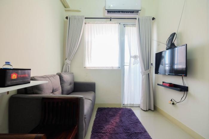 Tranquil 2BR @ Green Pramuka Apartment By Travelio