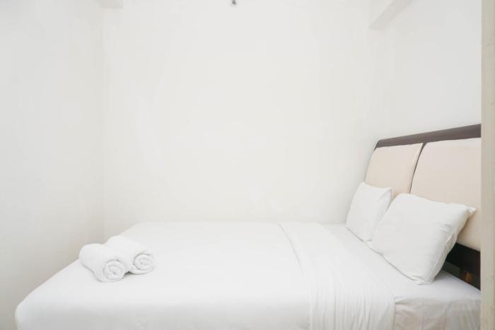 Spacious 2BR Green Bay Pluit Apartment By Travelio