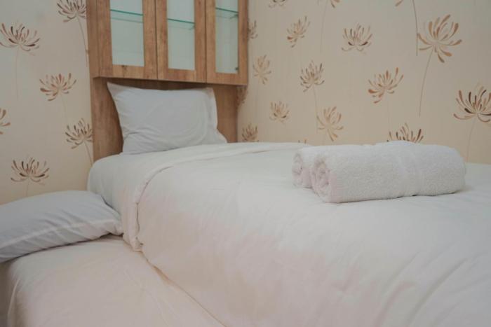 Best Furnished 2BR Mall Access at Green Pramuka Apartment By Travelio