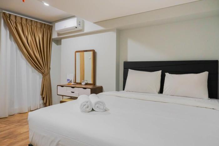 Modern 2BR Apartment at Maqna Residence By Travelio