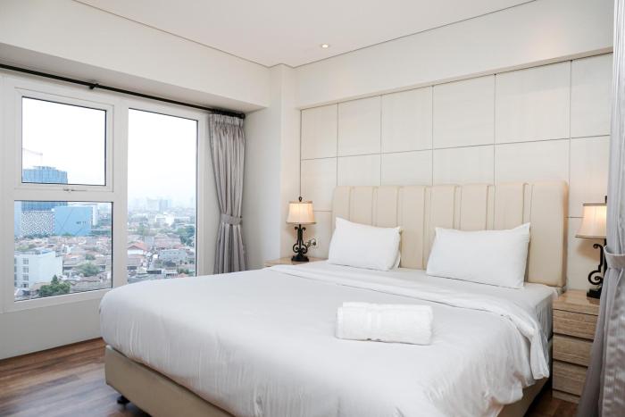 Stunning 2BR Loft Apartment at Maqna Residence By Travelio