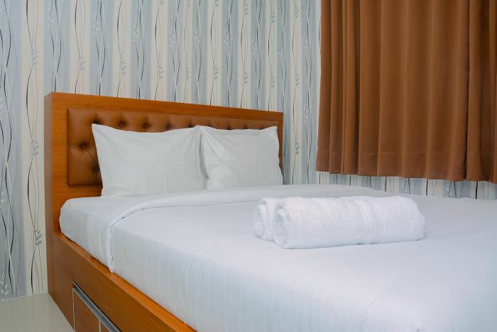 2BR Bassura City Apartment with Nice Interior Design By Travelio