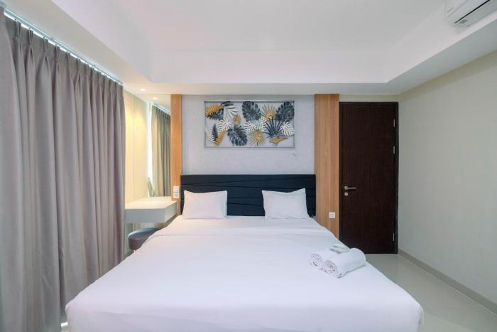 Cozy 2BR Apartment Nine Residence with City View By Travelio