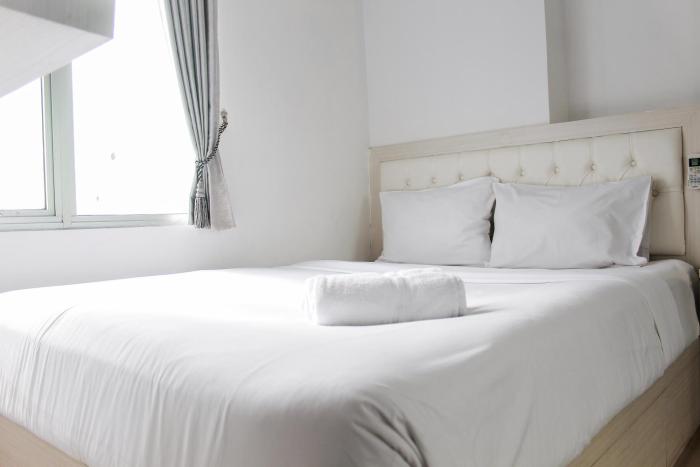 Comfort 2BR Bassura City Apartment near Shopping Center By Travelio