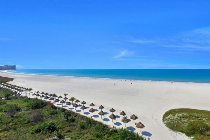 Sunny beachfront condo with pool and SW-facing balcony