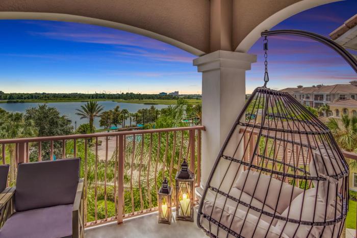 Top floor condo with view of lake, pool and fireworks! Next to Convention Center!