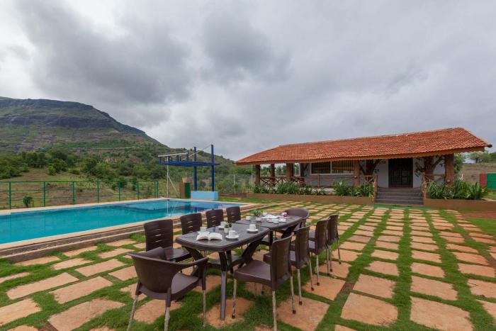 StayVistas Ficus Farms - Mountain-View Haven with Rustic Artsy Interiors, Outdoor Pool, Glasshouse, Home Theatre & Karaoke Delight