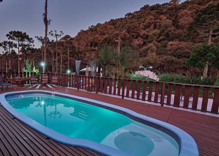 Suítes Pousada Jardim do Buda com café e piscina