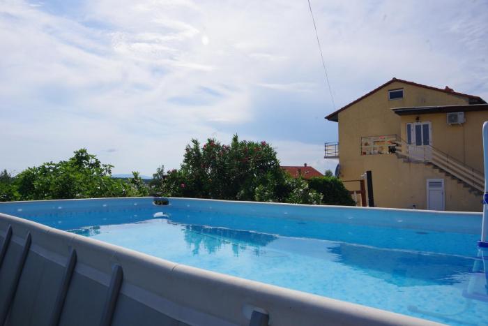 Family friendly apartments with a swimming pool Barbat, Rab - 4988