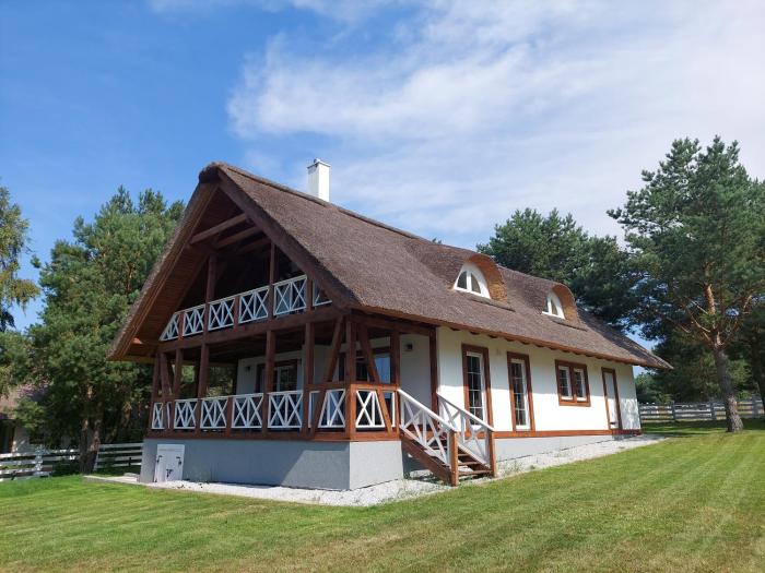 Greyówka dom kryty strzechą w Gardna Park