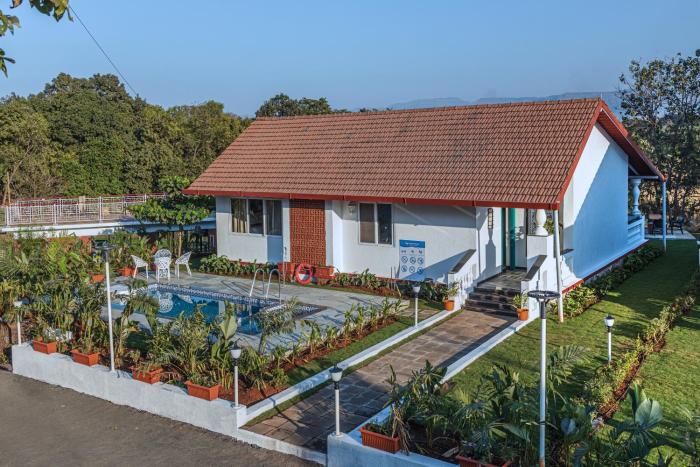 SaffronStays Mariposa Rio- 2BR Goan-style riverside pool villa with machan, garden & bonfire near Mumbai