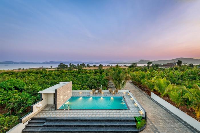 SaffronStays Mango Lakeview Villa - 3BR pool villa amid mango farms with Gangapur Dam views, deck & games