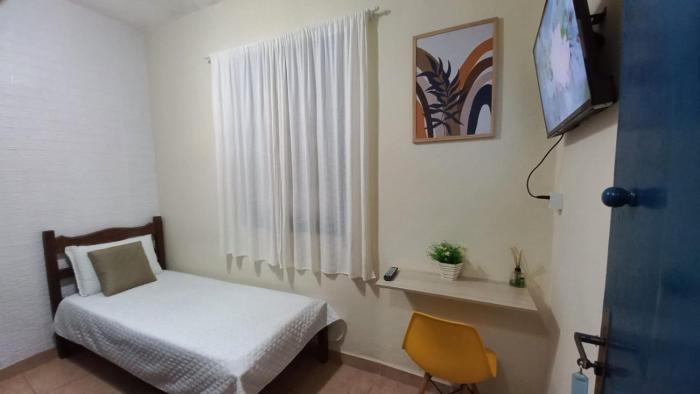 Quarto Individual em Hospedaria no Centro