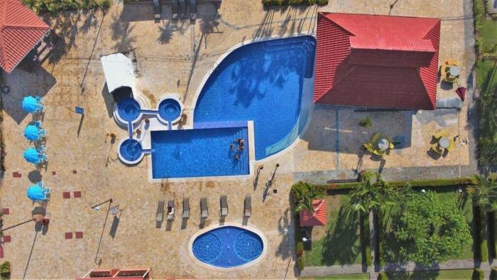 Centrally located in Jaco, walk to beach, beautiful pool! Each Villa Paradise is 1bd 1bath Condo Units sleep 5 or book both units and open connecting door for 10 ppl- Paradise Found!