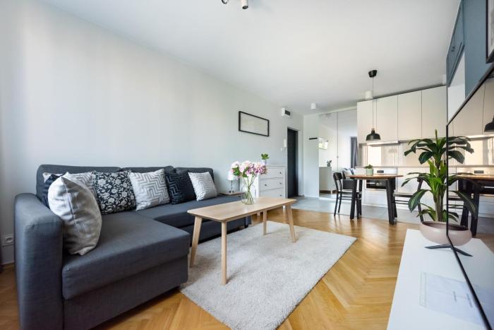 Nowogrodzka Grey Apartment by BookingHost