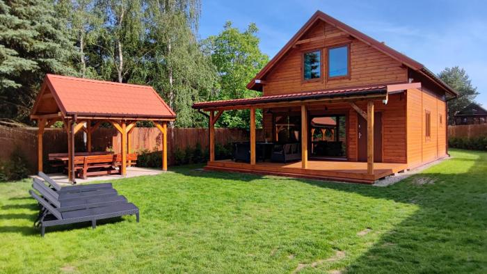 Nad Kalwą - Mazury całoroczny dom do wynajęcia z widokiem na jezioro - pomost - łódka - rower wodny