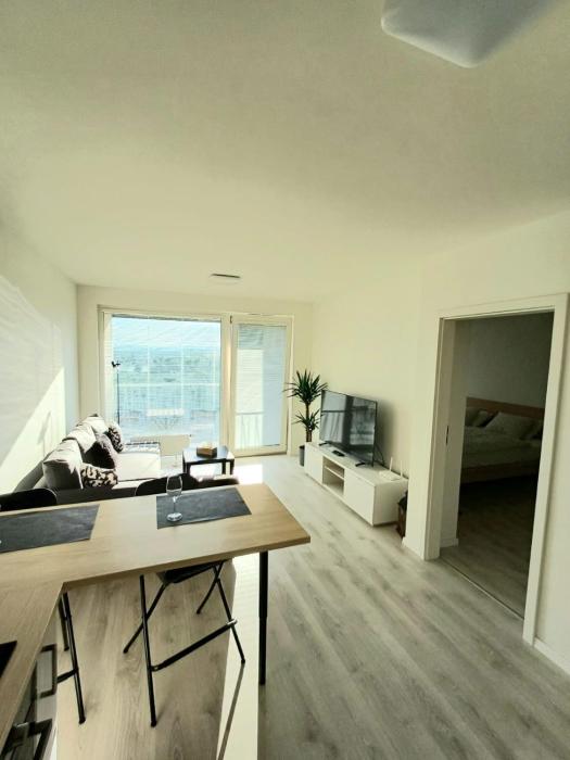 New air-conditioned apartment 5 minutes by walk from the airport with free garage parking