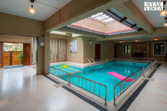 Otonia by StayVista with Indoor swimming pool, Modern interiors & a mix of indoor & outdoor games