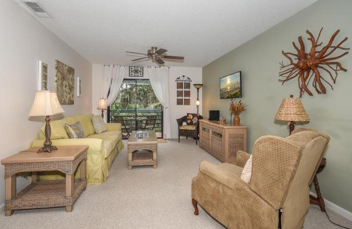 Beautifully updated bright and cheery 2nd story condo near pool beach access- SC261