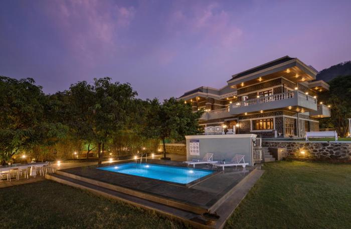 SaffronStays Peshwaai - 5BR Karjat villa with lawn pool & terrace plunge, mezzanine family rooms, near Songiri & Kondhana