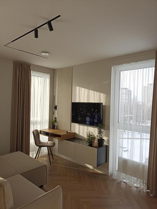 Apartments with a balcony and an impressive terrace on the roof of the house