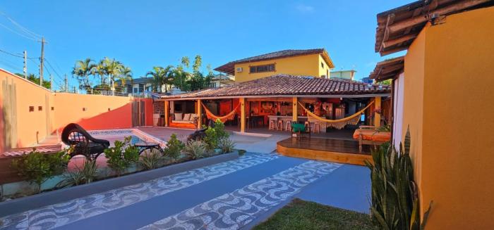 Casa Mukau pé na areia