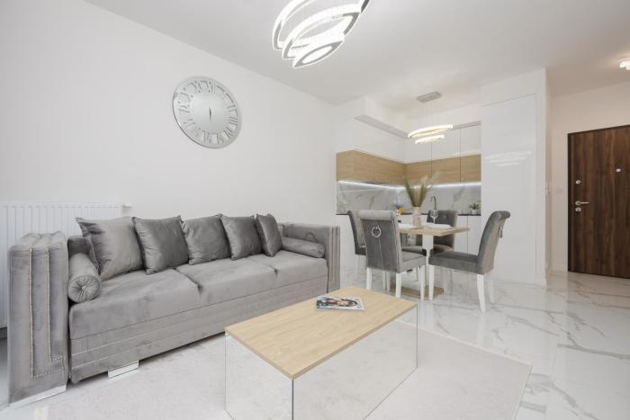 Luxurious Grey Apartment with Furnished Balcony and Parking by Renters