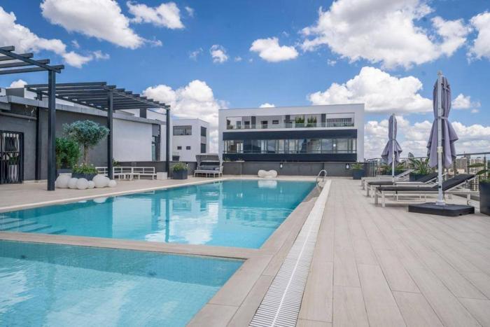 2BR Riverside luxury apartment with balcony & pool views