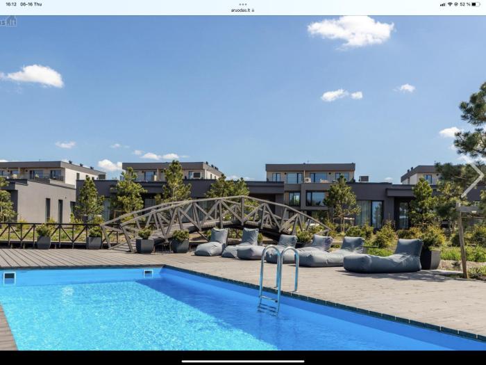 E&K apartamentai su šildomu baseinu kieme