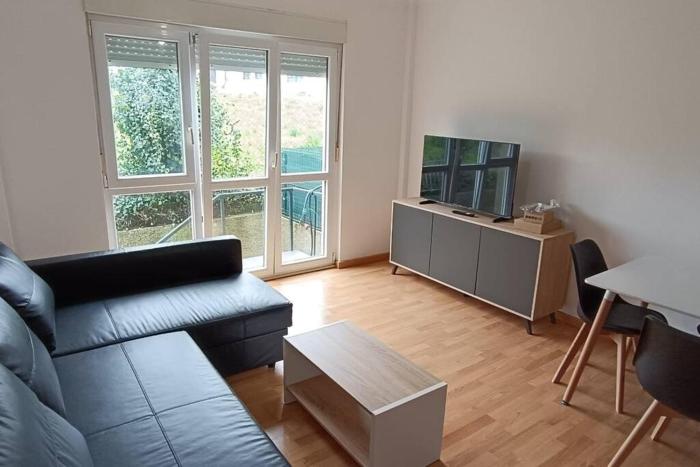 Apartamento con jardín y piscina junto a la playa