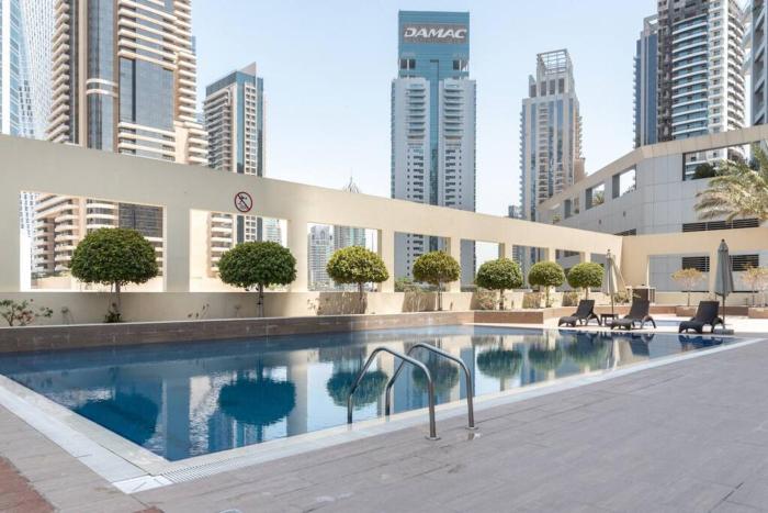 Stylish 1BR Apartment with City View Balcony Pool and Parking