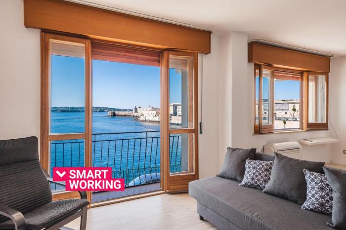 Una Finestra Su Cala Rossa by Wonderful Italy