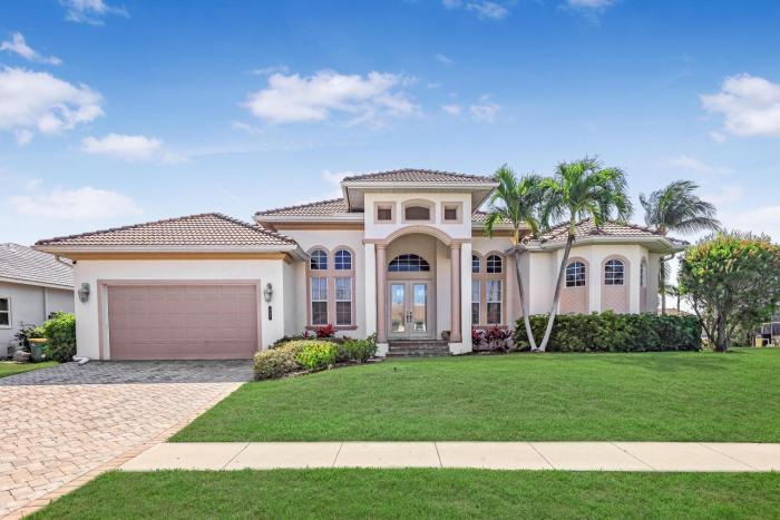 Beachy west exposure waterfront home with pool and spa