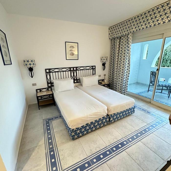 Suite privata al Domina club resort Acquamarine, Coral Bay, spa e casinó.