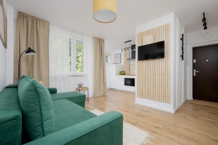 Cozy Apartment near Royal Baths Park by Noclegi Renters
