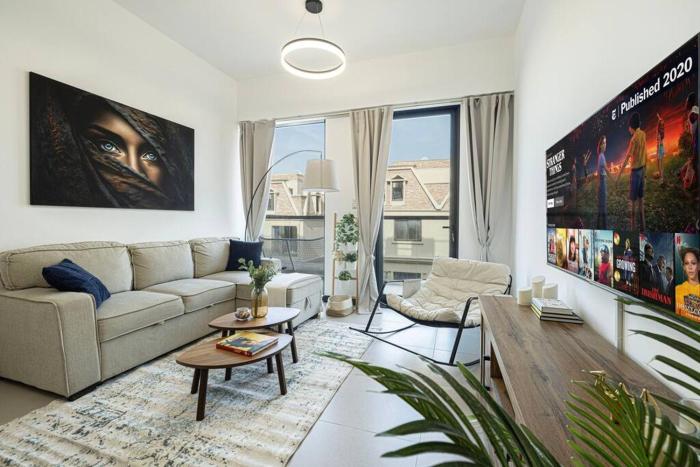 Large 1BR in JVC Sleeps 4 Rooftop, Pool & Gym