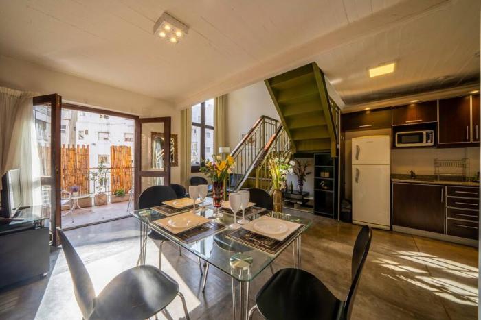 Enjoy natural light and garden view of this loft
