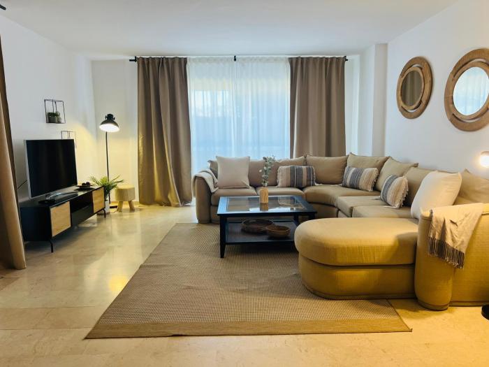 Impeccable large apartment with immense terrace and private garden overlooking the mountain, featuring 2 bedrooms and sleeping up to 4 guests located 100 meters from Plaza Maestranza