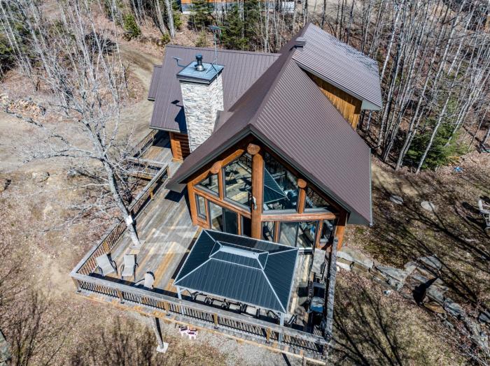 Chalet bois rond avec spa, foyer et nature privée