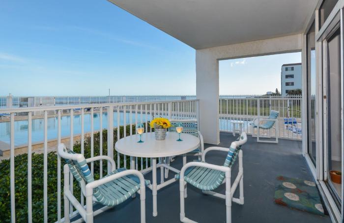 Ocean Condo 104 ~ Ground Floor Corner Condo with wrap around balcony Walk right out to Pool