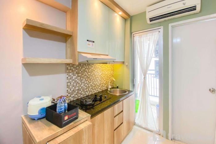 Best Strategic 2BR Apartment at Bassura City By Travelio