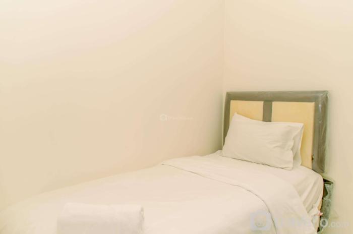 Modern Look 2BR Green Pramuka City Apartment near Mall By Travelio