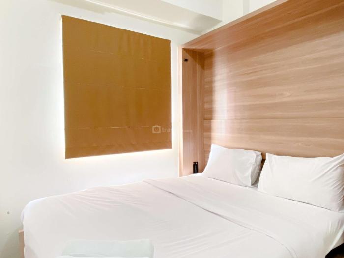 Comfort Designed 2BR Green Pramuka City Apartment By Travelio