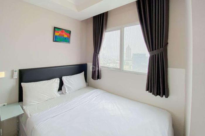 Homey and Warm 2BR at Signature Park Grande Apartment By Travelio