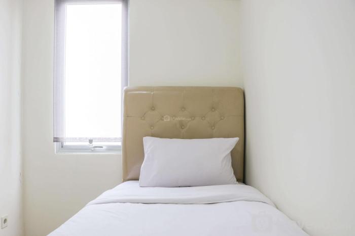 Stunning and Comfy 2BR Bassura City Apartment By Travelio