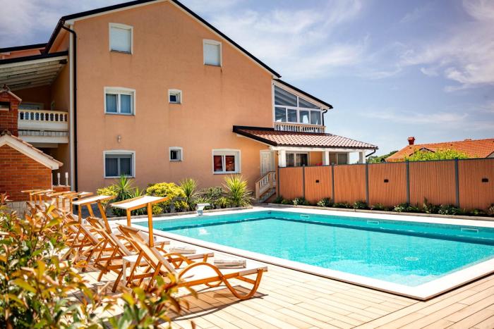 Apartments Foric Rab with Heated Pool, Sauna & Gym