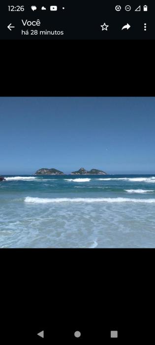 Lindo por do sol pe na areia