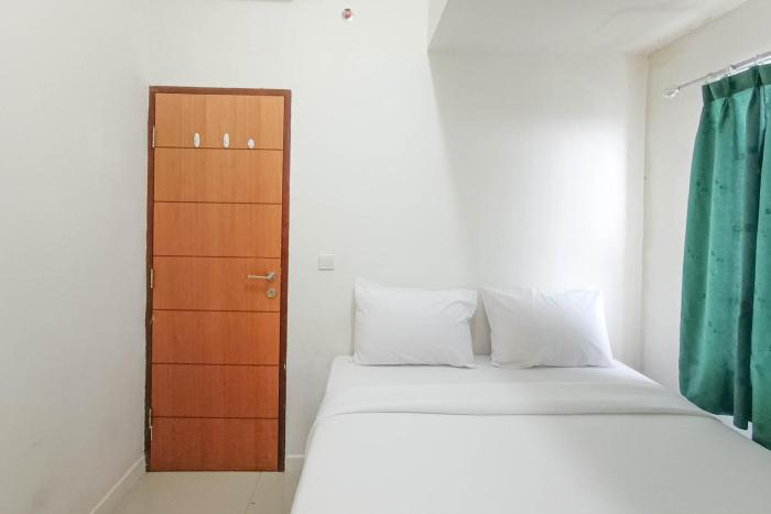 Nice and Homey 2BR at Vida View Makasar Apartment By Travelio